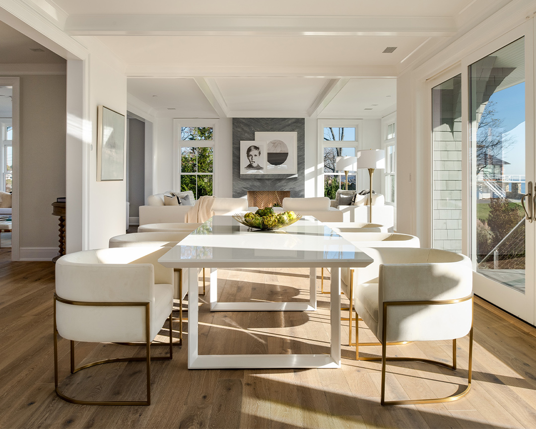 Modern, coastal living room with decorative accents and brown wood flooring
