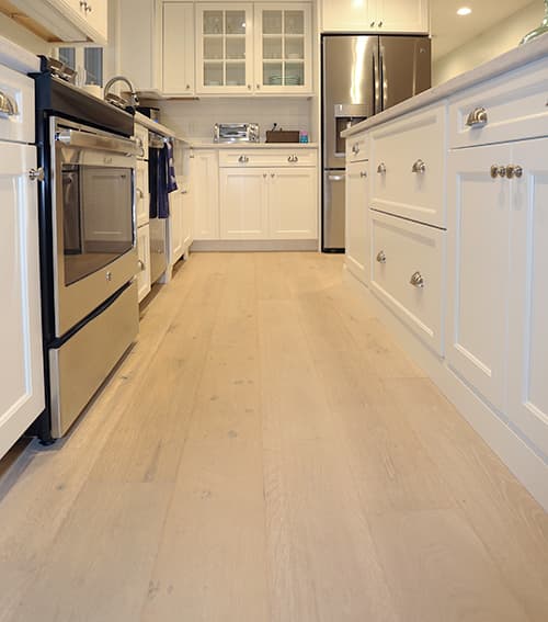 Sawyer Mason Structured Wide Plank Dune installed in Cozy Cottage Renovation Kitchen