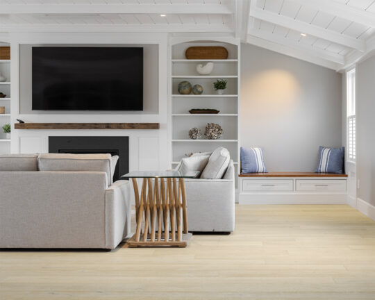 White and gray colored living room with matte finished hardwood floors