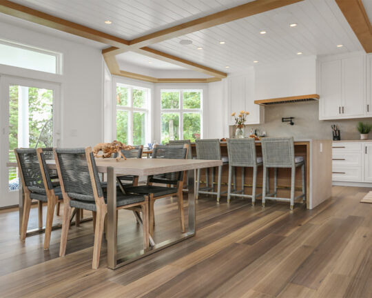 Kitchen and dining room with wood flooring.