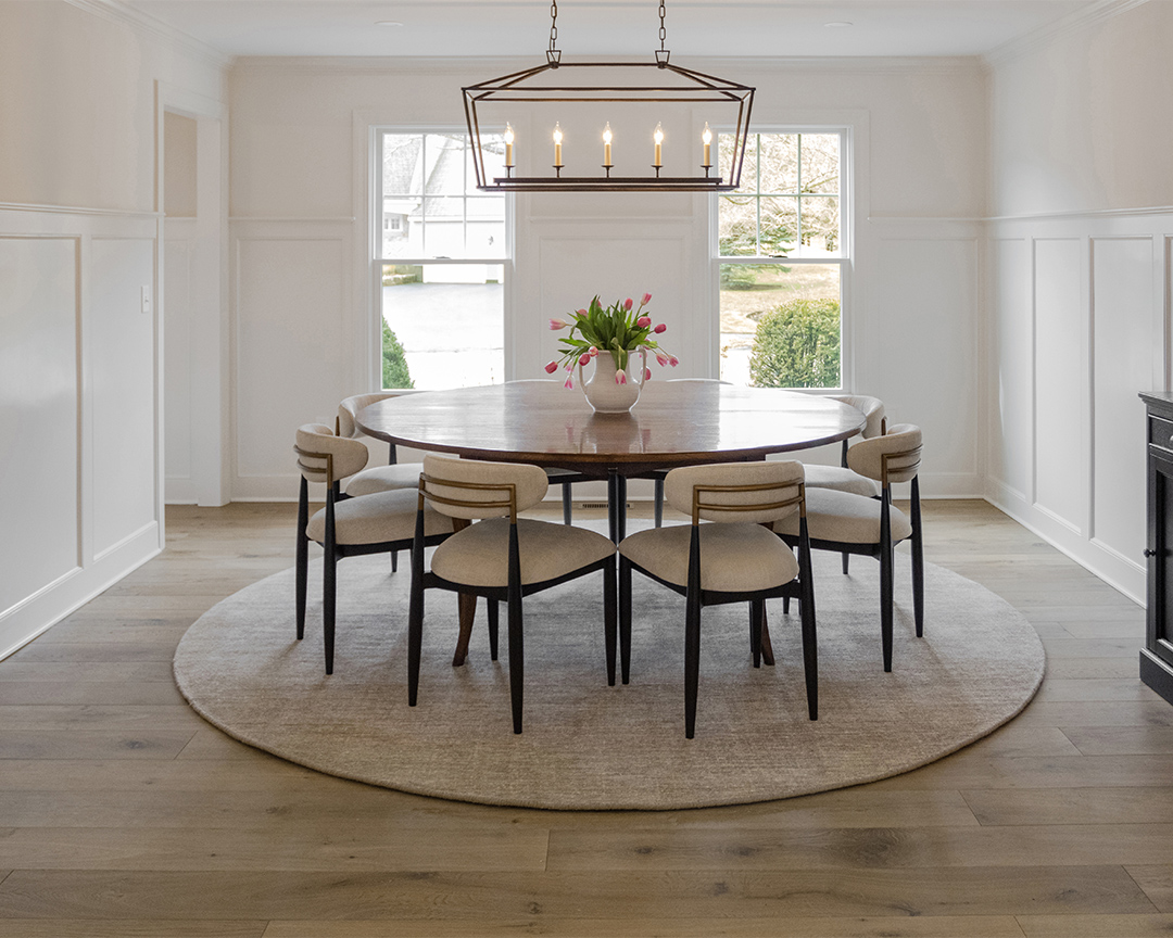 Bright and open dining space with oak wood floor