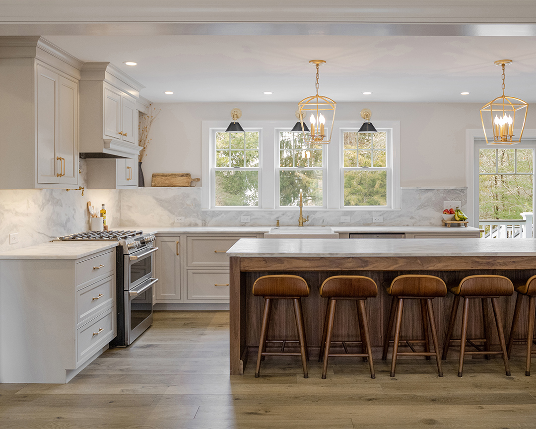 Traditional kitchen design with medium color wood flooring
