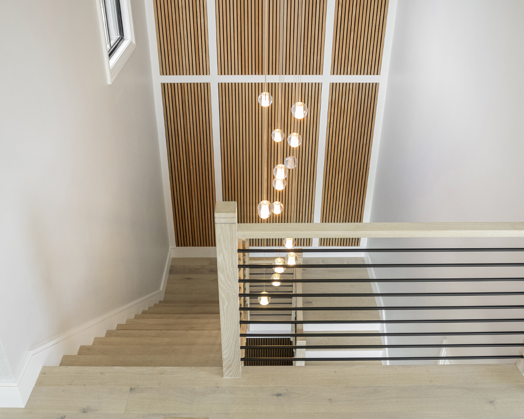 Sand colored wood flooring and staircase in a modern setting