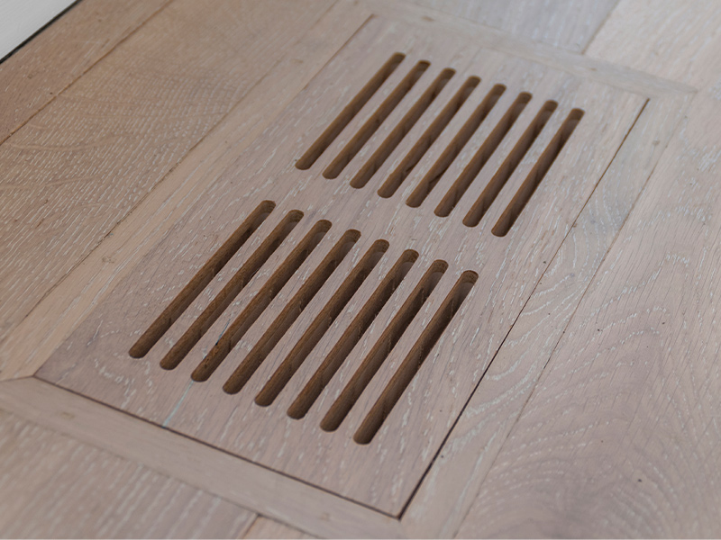 Air grille and matching wood flooring.