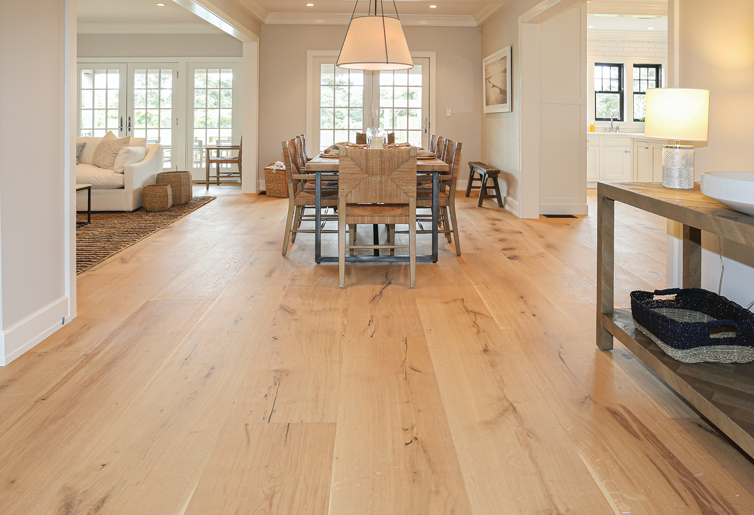 Wood floor interior coastal open concept.