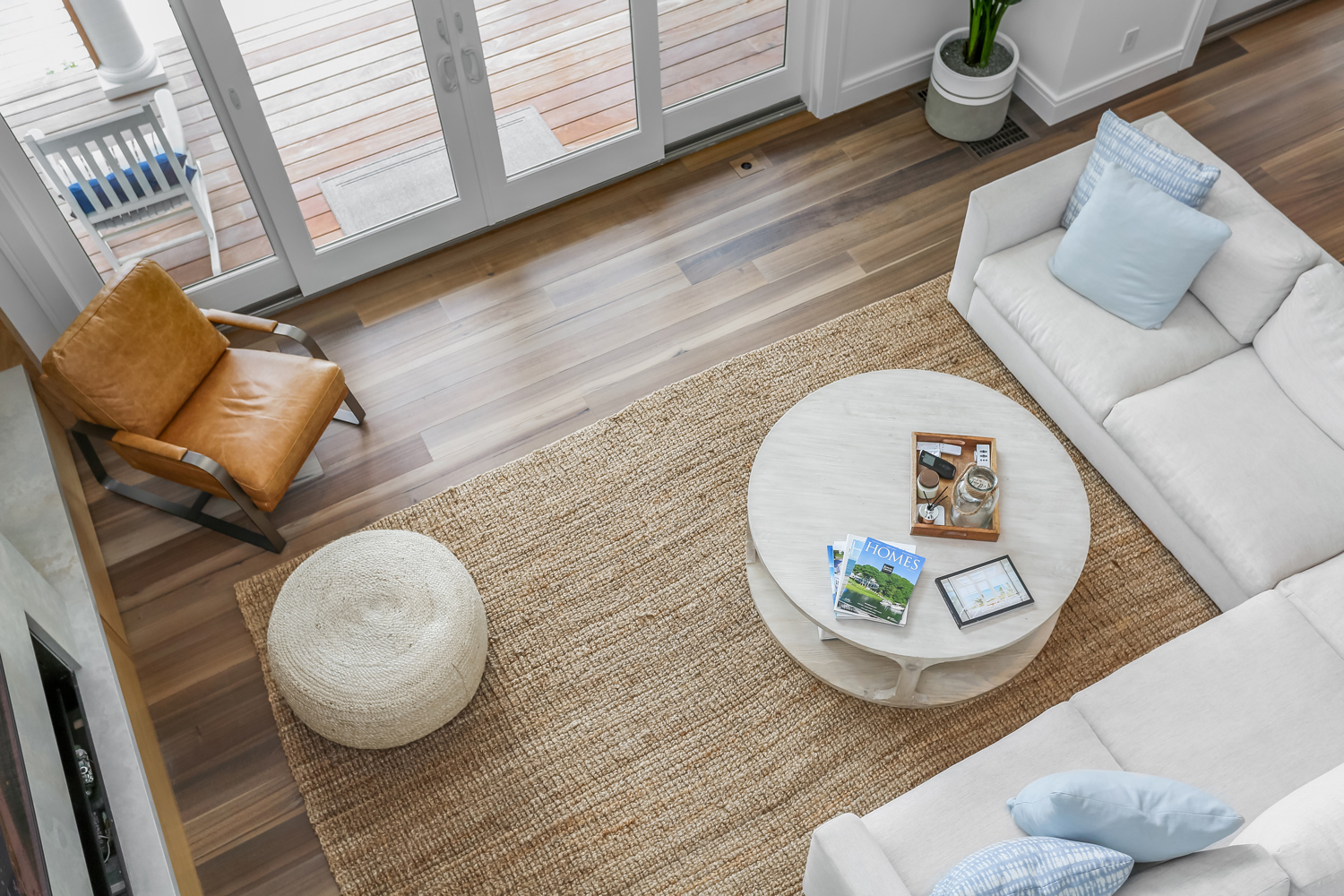 Top down shot of a living room with a uniquely colored wood floor.