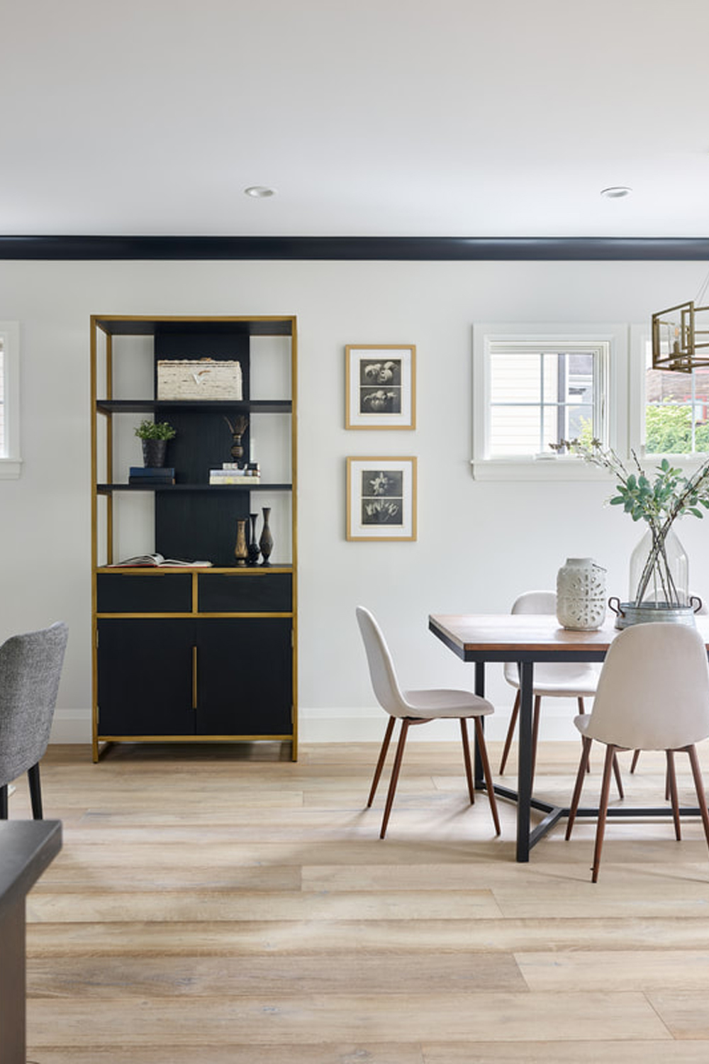 Modern style dining area and bookshelf with cabinets.