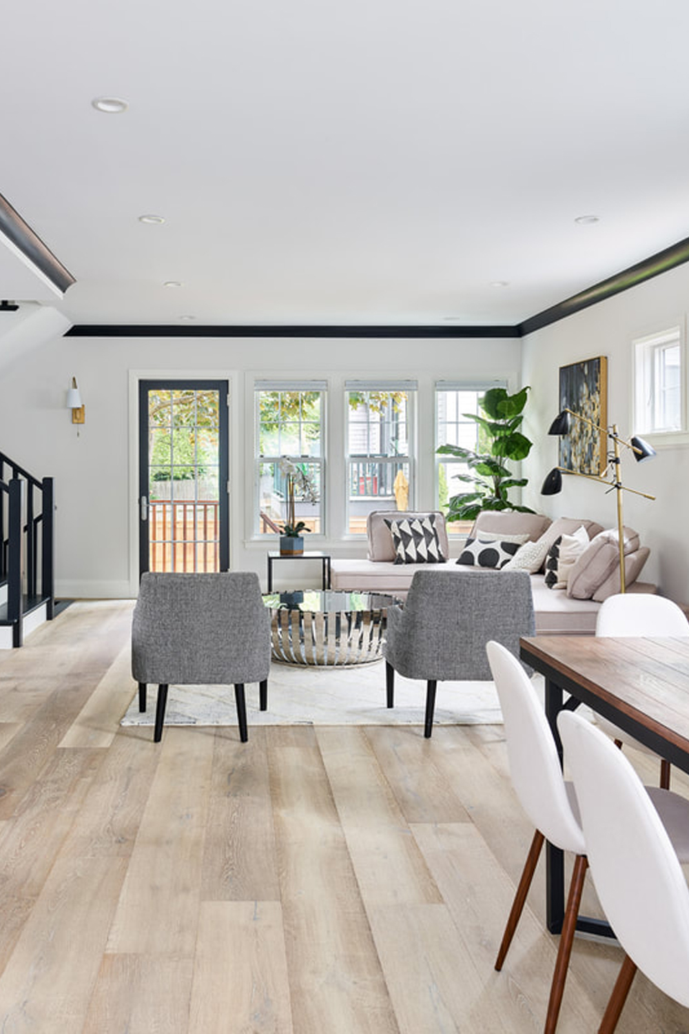 Luxury living room with natural wood flooring.