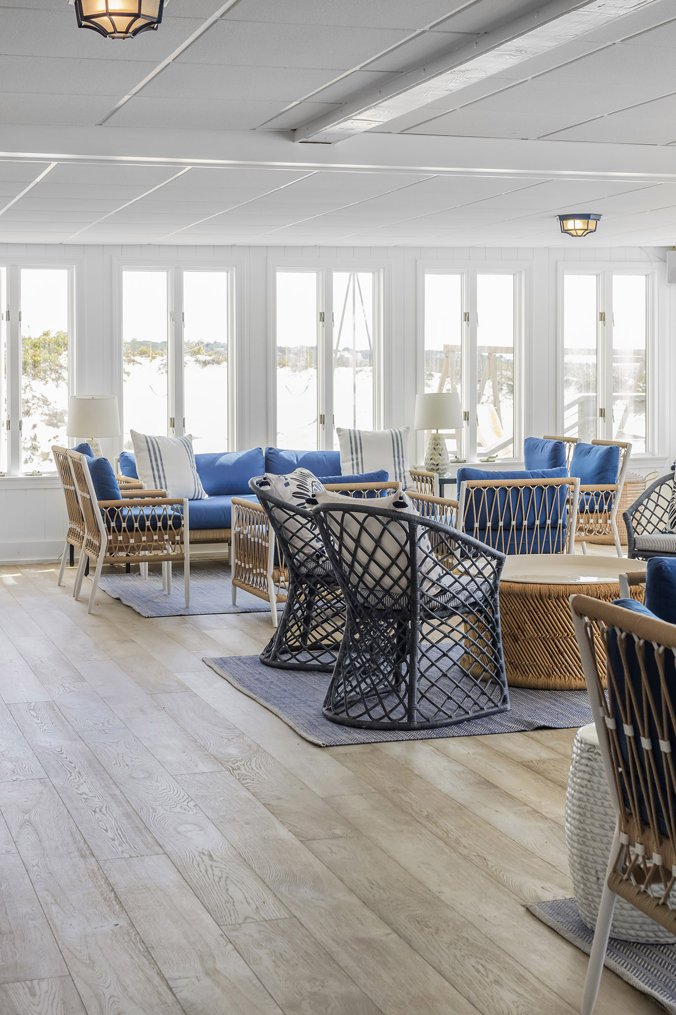Lounge area in a coastal commercial property with gray toned wood floor