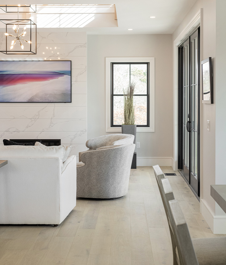 Light colored living room design with light oak flooring