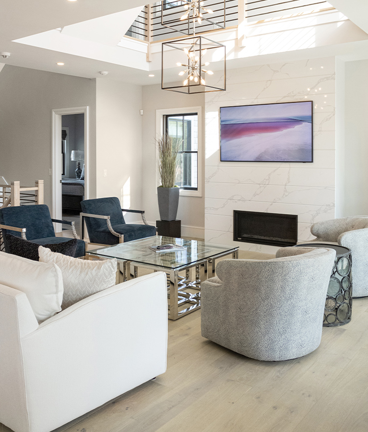Modern white and gray living room with painting and light wood flooring