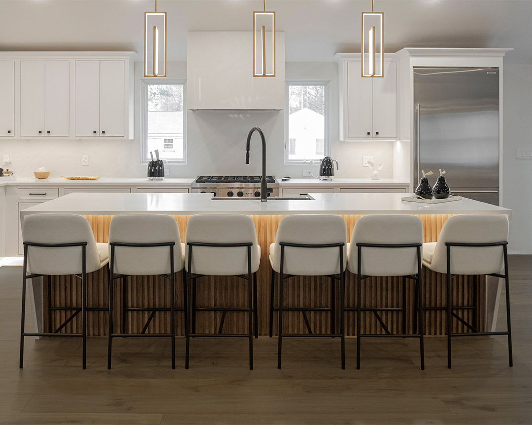 Modern kitchen with natural dark brown engineered flooring and white accents